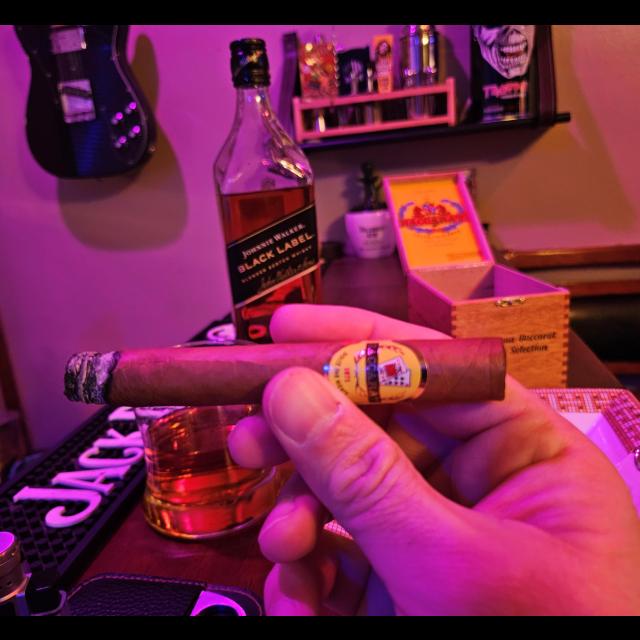 Baccarat 1871 cigar burning smoothly with solid white ash