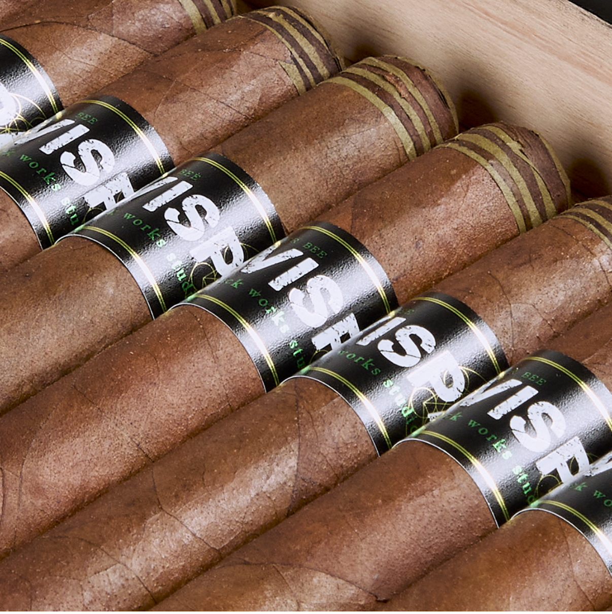 Black Works Studio Avispa cigars displayed in cedar row